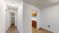Located at 10223 NE Notchlog Dr in Vancouver, WA, this one-bedroom, one-bathroom single-floor unit offers a clean, functional layout designed for comfortable everyday living. Wood-look flooring flows consistently throughout, complementing crisp white walls and textured ceilings to create a bright, neutral aesthetic.

The combined living and dining area is the heart of the unit, offering ample room for both relaxing and entertaining. A sliding glass door floods the space with natural light and opens directly onto a private patio, providing a pleasant outdoor retreat with greenery views.

The kitchen is efficiently laid out and features warm medium-toned wood cabinetry with sleek hardware, light countertops, a stainless steel refrigerator, and a dishwasher — offering a well-equipped space for cooking and meal preparation.

The bedroom is comfortably sized, featuring a large sliding-door closet and a window with outdoor views, allowing for natural light and ventilation. The full bathroom includes a combined tub and shower, a vanity with matching wood cabinetry, and wood-look flooring that ties the space together.

Notably, the unit includes an impressive five closets total, providing exceptional storage throughout. A dedicated utility room and an entrance area further enhance the practicality of the layout.