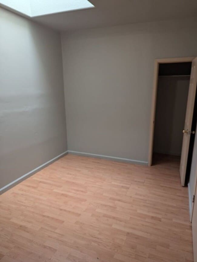 Building Photo - Bright & Inviting Home with Covered Patio, Gated Yard & Alley Access