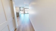 This contemporary 930 square foot apartment offers a harmonious blend of style and functionality. The open-concept design seamlessly integrates the kitchen and living areas, creating a spacious atmosphere ideal for both relaxation and entertainment. The kitchen boasts sleek cabinetry, stainless steel appliances, and a large island, perfect for meal preparation and casual dining.

Two well-appointed bedrooms, including a generous 160 square foot primary bedroom, provide ample space for rest and privacy. The bathrooms feature modern fixtures, with one showcasing a luxurious walk-in shower adorned with striking marble-like tiles.

Throughout the apartment, warm wood flooring contrasts beautifully with crisp white walls, creating a bright and inviting ambiance. Large windows and a private balcony offer scenic views and flood the space with natural light. The apartment also includes a convenient closet for additional storage.

Thoughtful lighting, including recessed lights and stylish fixtures, enhances the overall aesthetic. This turnkey residence combines comfort and sophistication, making it an ideal urban retreat in the heart of London, Ontario.