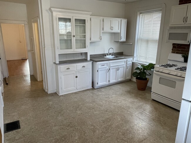 Large eat in kitchen. Previous resident fit a large table with 6 chairs. Gas stove. - 5313 Magnolia Ave