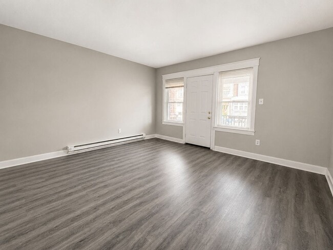 Photo - Spacious 3-Bedroom Rental with Front Porch, Backyard & Basement House