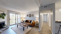 Located at 231 Bridgeway Circle in Nashville, TN, this single-floor, 2-bedroom, 3-bathroom home offers a well-designed layout that balances comfort and functionality. The living room serves as the heart of the home, featuring light wood-style flooring, a textured ceiling, and a sliding glass door that invites natural light and outdoor views. It connects seamlessly to a dedicated dining area, complete with a ceiling fan and matching wood-style flooring, ideal for everyday meals or entertaining. The kitchen is outfitted with white shaker-style cabinetry, dark countertops, stainless steel appliances, and ample storage, offering both style and practicality. A clean hallway with light flooring connects the main living areas to the private quarters. The generously sized primary bedroom features plush carpeting and a walk-in closet, providing abundant storage. The second bedroom also includes closet space and carpeted floors. Three full bathrooms serve the home, including one with a shower-tub combination and wood-look tile flooring. Two closets throughout the unit provide additional storage. The overall aesthetic is cohesive and contemporary, with neutral tones and modern finishes throughout.