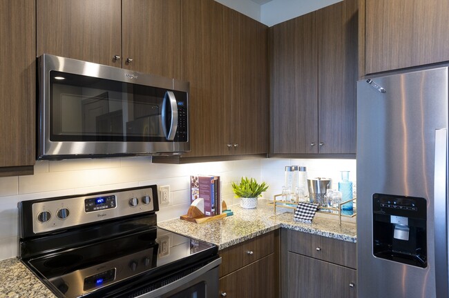 Our chef-inspired kitchens feature designer finishes and tile backsplash - Windsor Shepherd