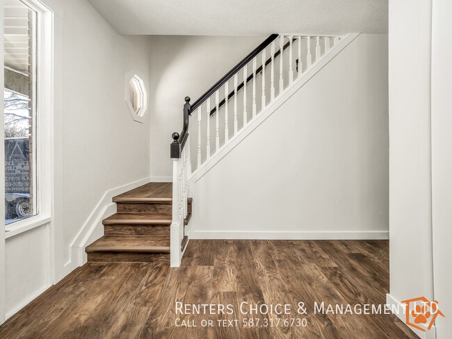 Building Photo - 2-storey Main Floor Suite with Driveway Pa...