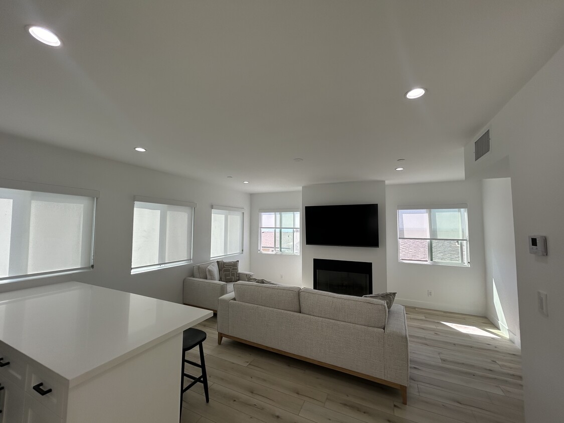 Living Room with gas / wood burning fireplace - 221 36th Pl