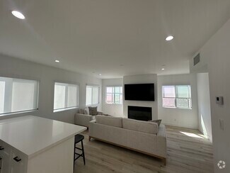 Living Room with gas / wood burning fireplace - 221 36th Pl