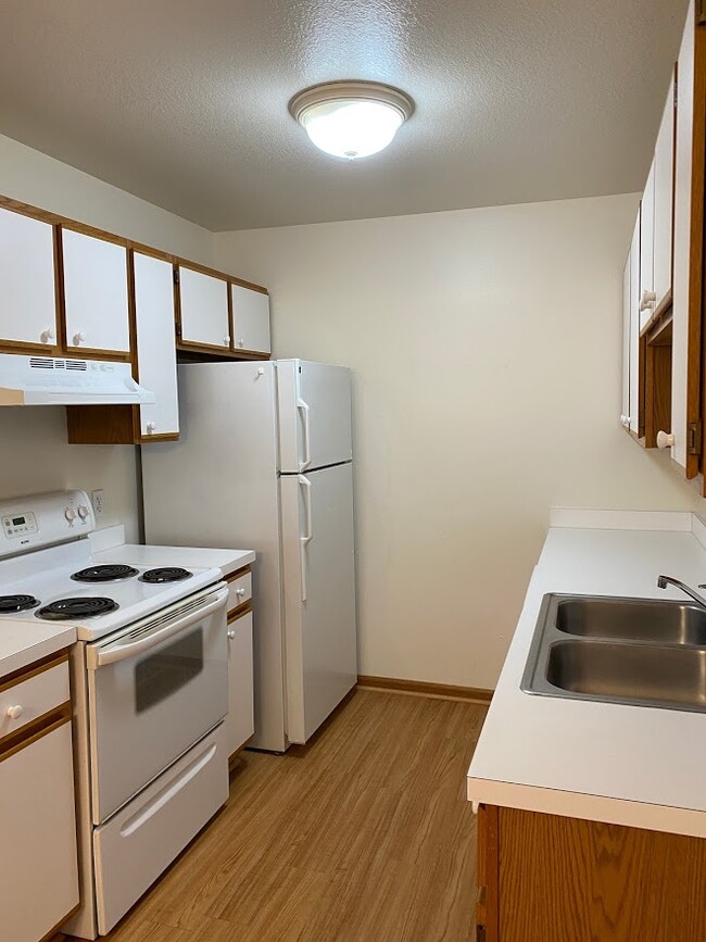 Kitchen with dishwasher, stove and fridge - 7481 Crosscreek Dr