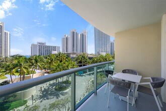 Building Photo - 19370 Collins Ave