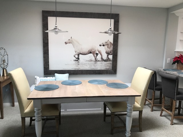 Dining Table seats 4 with one bench that contains storage and 2 additional bar stools at Kitchen counter - 282 Dolphin Cove Ct