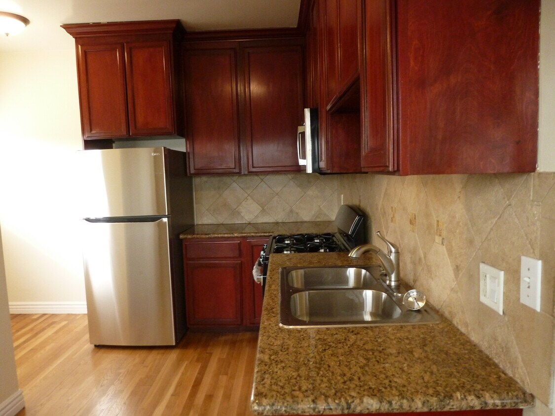 Upstairs unit kitchen - 721 N Madison Ave
