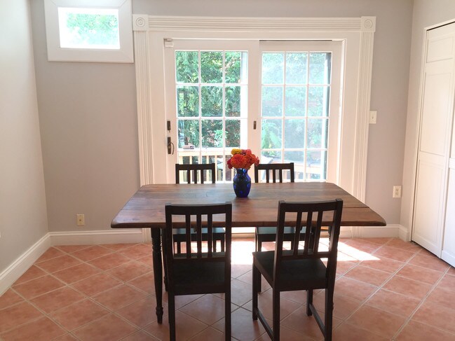 Sunny dining room with french doors to deck - 623 South Carolina Ave SE
