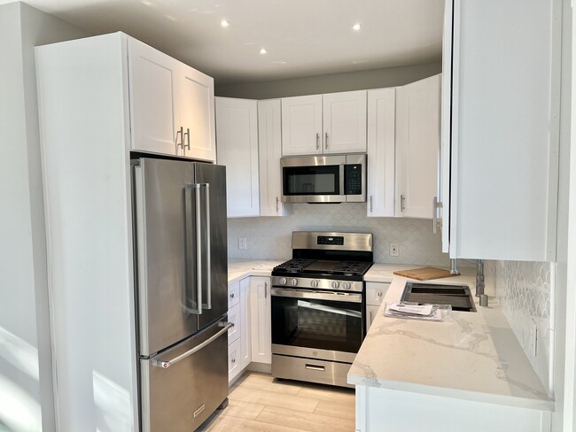 Kitchen with Quartz Countertops - 7649 Genesta Ave