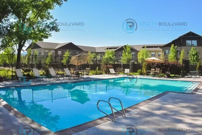 Building Photo - 1/2 Month Free!! Indulge in comfortable living at Wood Chase Condos!