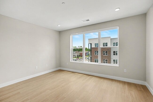 Elevate your living experience at Trail House Apartments with this spacious, light-filled unit. Large windows showcase stunning views, perfect for a cozy ambiance. Ready to make this space your own? Schedule a tour today! - Trail House Apartments
