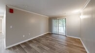Located at 500 Manor View Dr in Knoxville, Tennessee, this single-floor, three-bedroom, three-bathroom home offers a well-designed layout with modern finishes throughout. The open-concept kitchen is a standout feature, boasting white shaker cabinetry, granite countertops, stainless steel appliances, and light wood-look flooring that extends into the adjoining living area. The living room is bright and welcoming, with crown molding accents, recessed lighting, and a sliding glass door that invites natural light and outdoor views. Each bedroom is carpeted for comfort and equipped with a ceiling fan and natural light from windows. The bedrooms include closet space, with at least one featuring a sliding-door closet with built-in shelving. The bathrooms are clean and functional, with one featuring a granite-topped vanity with white cabinetry and a walk-in shower with built-in shelving. A dedicated laundry room houses a full-size side-by-side washer and dryer with overhead shelving for additional storage. Neutral wall tones and consistent flooring create a cohesive, move-in-ready aesthetic throughout the home. The overall ambiance is clean, modern, and practical, making it an ideal residence in the Knoxville area.