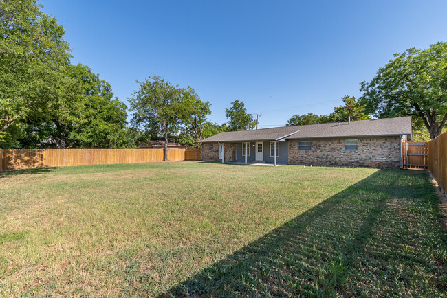 Large back yard, privacy fence - 208 W. Fourth St.