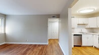 Located at 1249 Hampshire Pike in Columbia, TN, this one-bedroom, one-bathroom unit offers a compact yet well-organized single-floor layout. Warm hardwood-style flooring flows consistently throughout the space, creating a cohesive and inviting atmosphere.

The living room provides an open, functional area with neutral gray walls and clean white trim, connecting seamlessly to the kitchen via an open passageway. The kitchen is a standout feature, equipped with crisp white shaker-style cabinetry, light granite-look countertops, and a full suite of stainless steel appliances including a refrigerator, range, and dishwasher — offering a modern, practical cooking space.

The bedroom is a comfortable, well-proportioned retreat featuring natural light from a window with blinds, a ceiling fan with light fixture, and a closet. The room's neutral tones and warm flooring lend a relaxed, restful ambiance.

A hallway connects the main living areas to the bedroom and bathroom, providing a functional flow throughout. The bathroom features a clean, white tub-shower combo, a toilet, and a simple, practical design.

Overall, this unit delivers a clean, move-in-ready space with consistent finishes and efficient use of its footprint, well-suited for comfortable single-occupant or couple living in Columbia, TN.