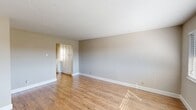 This 640 square foot apartment in Walnut Creek offers a thoughtful layout with two bedrooms and one bathroom. The living area showcases warm hardwood flooring, creating an inviting atmosphere enhanced by large windows that flood the space with natural light. The kitchen boasts a modern design with sleek white cabinetry, stainless steel appliances, and ample counter space, ideal for meal preparation and casual dining.

Both bedrooms feature plush carpeting and ceiling fans, with the primary bedroom measuring a comfortable 140 square feet. The bathroom presents a contemporary aesthetic with a wood-finish vanity and a shower-tub combination. Throughout the apartment, neutral-toned walls provide a blank canvas for personalization.

Additional amenities include window blinds for privacy and light control, as well as built-in closets for storage. The property's single-floor design ensures easy accessibility, while its location at 1865 Lacassie Ave offers the convenience of urban living in Walnut Creek. This apartment combines functionality and style, making it an attractive option for those seeking a modern living space in a desirable area.