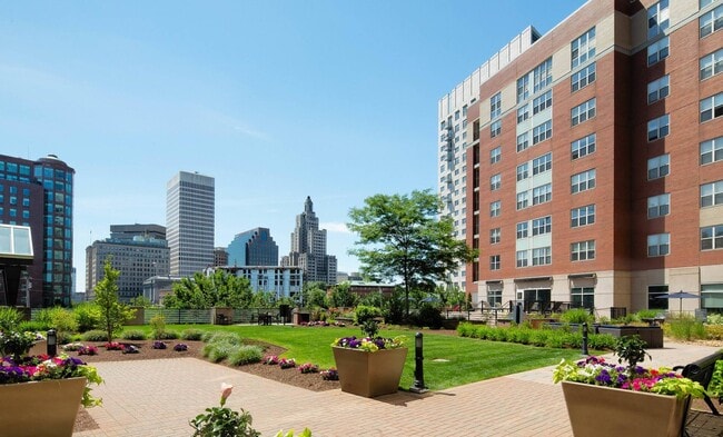 Unwind outdoors with skyline views and greenery. - Center Place