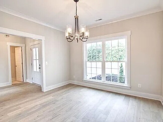 Building Photo - Situated on over 3 acres right in a growin...