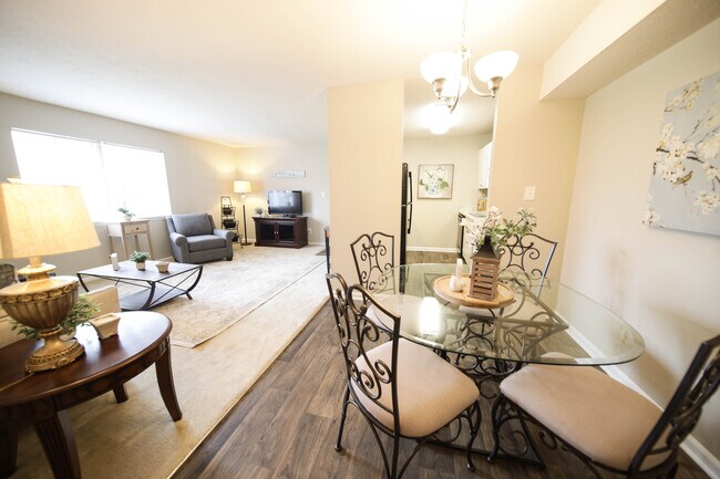 Spacious, landscaped outdoor terrace with lush seating, grills and a fire pit - Raintree Apartments