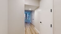 Step into a world of contemporary luxury in this exquisitely crafted studio. The open-concept layout maximizes every inch of the 400 sq ft space, creating an airy, expansive feel. Sunlight streams through large windows, illuminating sleek wood floors and crisp white walls. The gourmet kitchen boasts high-end stainless steel appliances and rich wood cabinetry, ideal for culinary enthusiasts. The spa-like bathroom features modern fixtures and a statement backlit mirror. This turnkey residence embodies the essence of sophisticated city living, offering a personal sanctuary amidst the vibrant energy of New York.