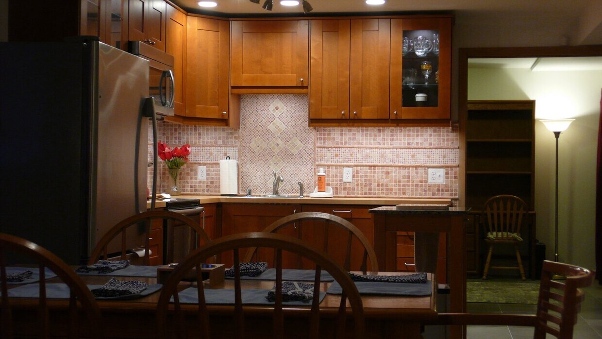 Dining room / Kitchen with remote-controlled lighting and soft-close drawers and cabinets - 2646 Shadow Ln