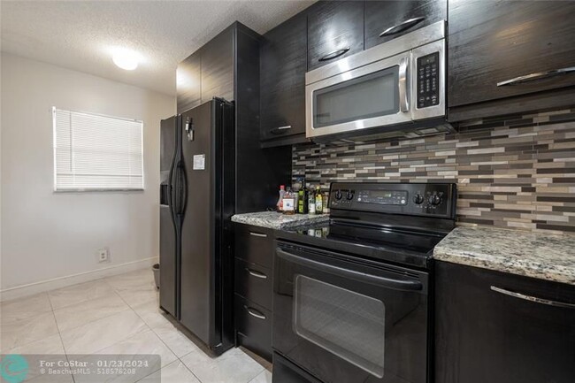 Building Photo - 7410 Woodmont Terrace