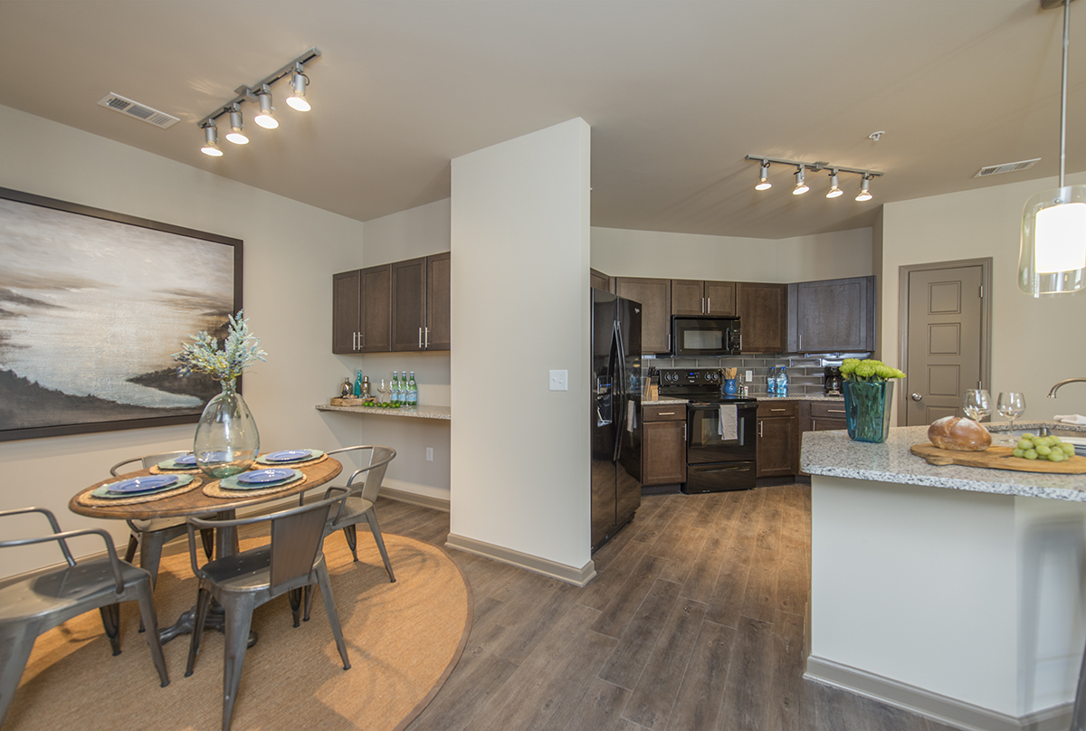 Spacious Dining Room with Work Area and View into Large Open Kitchen | Apartments in Nashville | 909 Flats - 909 Flats