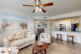 Located at 500 Malabar Road Southwest in Palm Bay, Florida, this single-story, 3-bedroom, 2-bathroom home offers a practical and comfortable layout designed for everyday living. The open-concept main living area features wood-look flooring throughout and a ceiling fan with light fixture, creating a bright and airy atmosphere. A large window brings in natural light, offering pleasant outdoor views and enhancing the welcoming ambiance of the living room.

The kitchen is a functional highlight, featuring granite countertops, white cabinetry, black appliances including a refrigerator, range, and microwave, as well as a peninsula with bar seating that connects seamlessly to both the living and dining areas. A dedicated pantry provides additional storage convenience.

The dining area is positioned adjacent to the kitchen and living room, completed with pendant lighting and easy access to the rest of the home. Two full bathrooms include a tub-shower combination with granite vanity countertops and wood-look flooring.

The three bedrooms are carpeted and each features a window with outdoor views, providing natural light and a comfortable retreat. Multiple closets throughout the home offer ample storage. A dedicated laundry room adds further practicality to this well-organized floor plan.