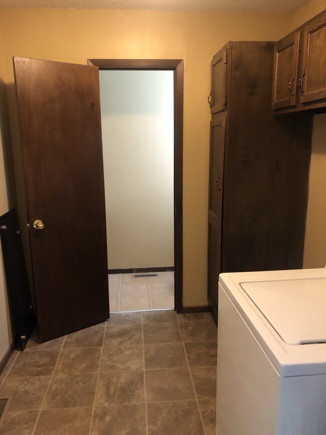 Large main floor laundry with 1/2 bath attached! - 2013 N Old Manor Rd