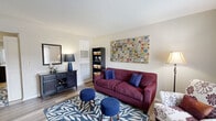 Located at 209 Casalon Dr in O'Fallon, Missouri, this 2-bedroom, 1-bathroom single-floor home offers a thoughtfully organized layout that maximizes every square foot. The living room serves as the heart of the home, featuring wood-look plank flooring, a textured ceiling, and a bright front entry door flanked by a window that fills the space with natural light. The open kitchen and living area flow seamlessly together, with the kitchen showcasing warm wood cabinetry, stainless steel appliances including a refrigerator and range, a peninsula with a light countertop, and a ceiling fan overhead — ideal for both cooking and casual dining. A hallway connects the main living areas to the private quarters. The spacious primary bedroom is carpeted and features a window with natural light, wall-mounted décor shelving, and a direct-access door. The second bedroom, also carpeted, includes two windows and ample space for flexible use. The shared full bathroom offers a single-sink vanity with a white countertop, wood-toned cabinetry, a shower/tub combination, and wood-look flooring. Throughout the home, a neutral color palette and textured ceilings create a clean, cohesive aesthetic well-suited for comfortable, functional living.