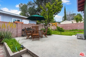 Building Photo - 10706 Rhodesia Ave