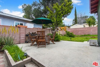 Building Photo - 10706 Rhodesia Ave