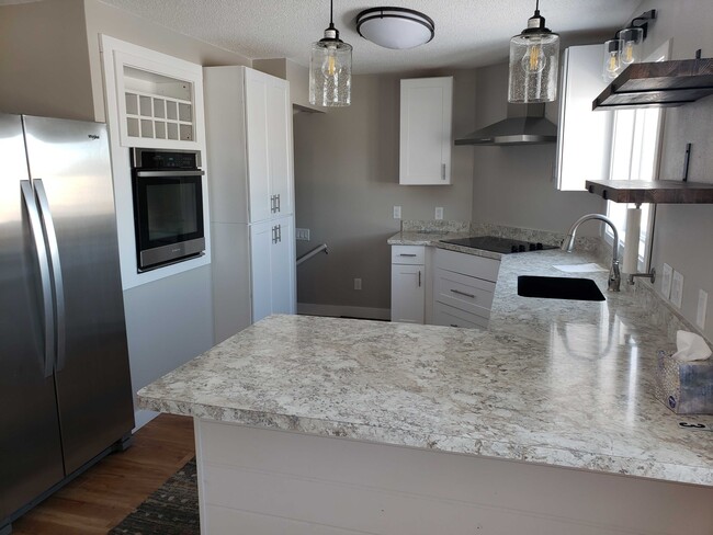 New Kitchen. Stove top separate from built in oven. Dish washer / dish disposal. - 1213 1st Ave NE