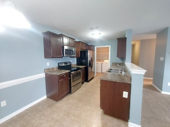 Building Photo - 3 Bedroom 2 Bath Condo 1st  Floor Located ...