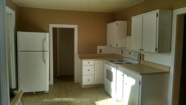 Kitchen - Refrigerator and electric stove furnished. - 111 Washington Avenue