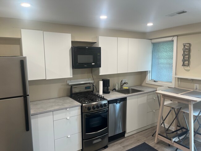 Kitchen, includes stove, microwave, dishwasher, all new cabinets - 803 Euclid Street Northwest