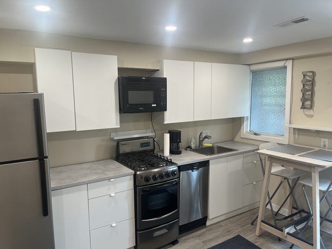 Kitchen, includes stove, microwave, dishwasher, all new cabinets - 803 Euclid Street Northwest