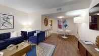 Located at 900 Downtowner Boulevard in Mobile, Alabama, this two-story, 2-bedroom, 3-bathroom home offers a practical and comfortable layout evenly divided across two floors. The main level welcomes you into a bright living room featuring a mix of tile and hardwood-style flooring, large windows that invite natural light, and an open flow into the dining area. The kitchen is equipped with warm oak cabinetry, white appliances including a range and refrigerator, a dishwasher, and tile flooring, with a back door providing convenient outdoor access and a staircase leading to the upper level. A dedicated laundry room with a full-size washer and dryer adds everyday practicality. Three bathrooms are distributed throughout the home — one features a granite-topped vanity, while another offers a full tub-shower combination with clean white tile surround. Upstairs, both bedrooms are carpeted and include ceiling fans. The generously sized primary bedroom offers ample space, natural light from a large window, and direct access to a closet and adjoining bathroom. The second bedroom is equally comfortable with a ceiling fan and bright window. With two closets and a hallway connecting the upper level, this home provides efficient, functional living across every room.