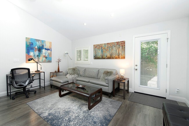 TV seating area next to a Dedicated Workstation - 73 Summerfield St