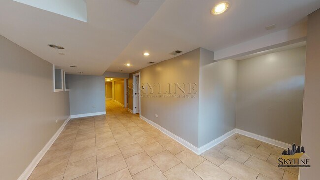 Building Photo - 4810 S Langley Ave