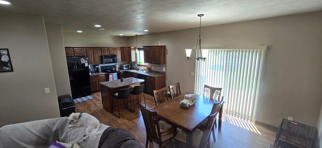 Open Kitchen and Eating Area with Access to Yard from Patio Door - 8413 W 53rd St