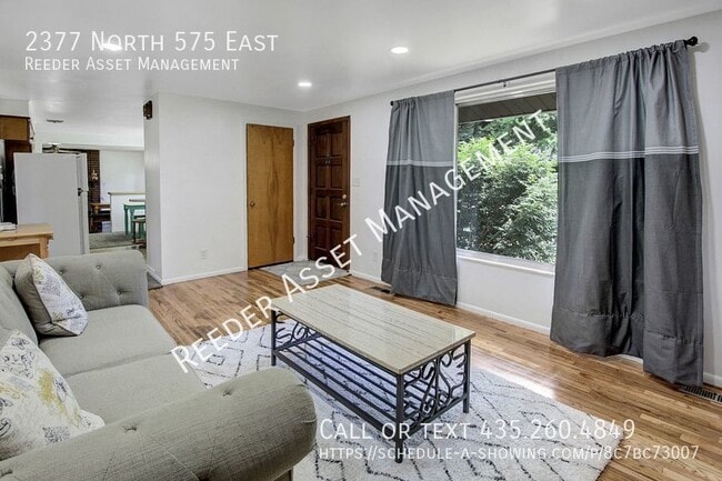 Building Photo - Welcome to this charming 4-bedroom, 2-bath...