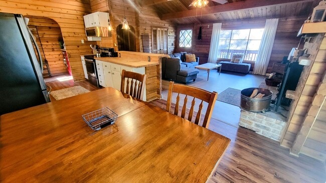 Building Photo - Move-In Ready 2-Bedroom Log Home with Wrap-Around Deck and Enclosed Yard