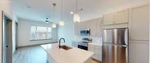 This contemporary 630 square foot apartment offers a thoughtful layout maximizing space and functionality. The open-concept design seamlessly integrates the living area with the kitchen, creating an expansive feel. The kitchen boasts white cabinetry, stainless steel appliances, and a central island with a sink, perfect for both meal preparation and casual dining.

The bedroom, measuring 140 square feet, features plush carpeting and large windows that flood the space with natural light. The bathroom is sleek and modern, with a white vanity, large mirror, and ample storage space.

Throughout the apartment, hardwood floors add warmth and elegance, while large windows provide stunning city views. A private balcony offers outdoor space for relaxation or entertainment. The unit also includes a closet for additional storage.

Located in Denver's desirable 80238 zip code, this apartment combines urban living with modern comforts. The building's amenities and prime location make it an ideal choice for those seeking a stylish and convenient city lifestyle.