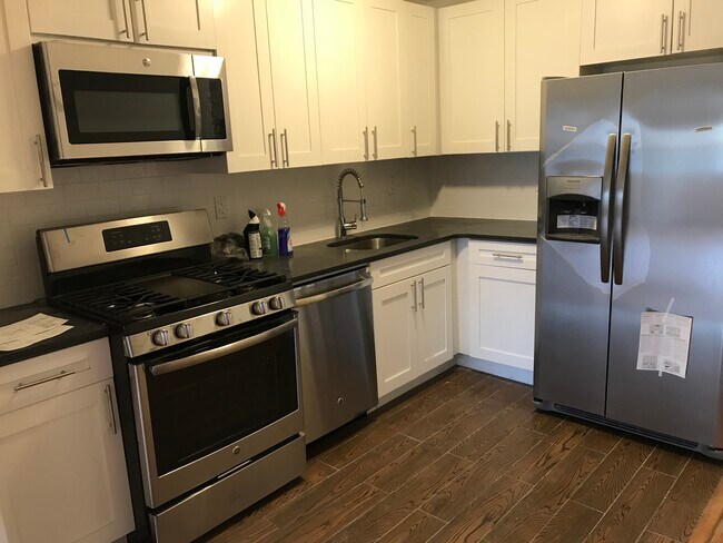 kitchen with brand new stainless steel appliances including dishwasher - 2313 Pacific street