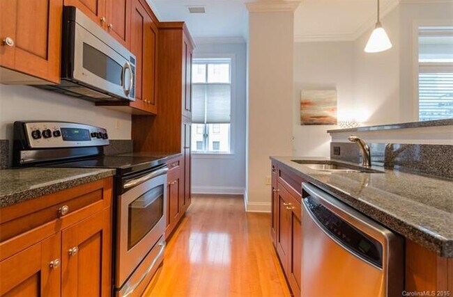 Kitchen with view of window - 230 S Tryon St