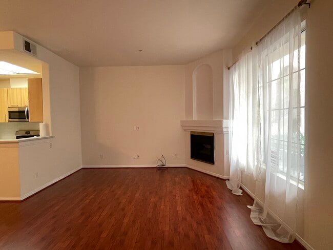living room and kitchen to the left - 7037 La Tijera Blvd