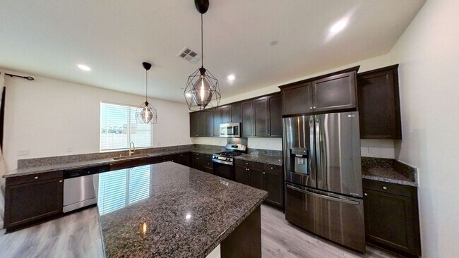 Building Photo - PRICE REDUCTION! Beautiful 4 Bedroom 3 Bat...